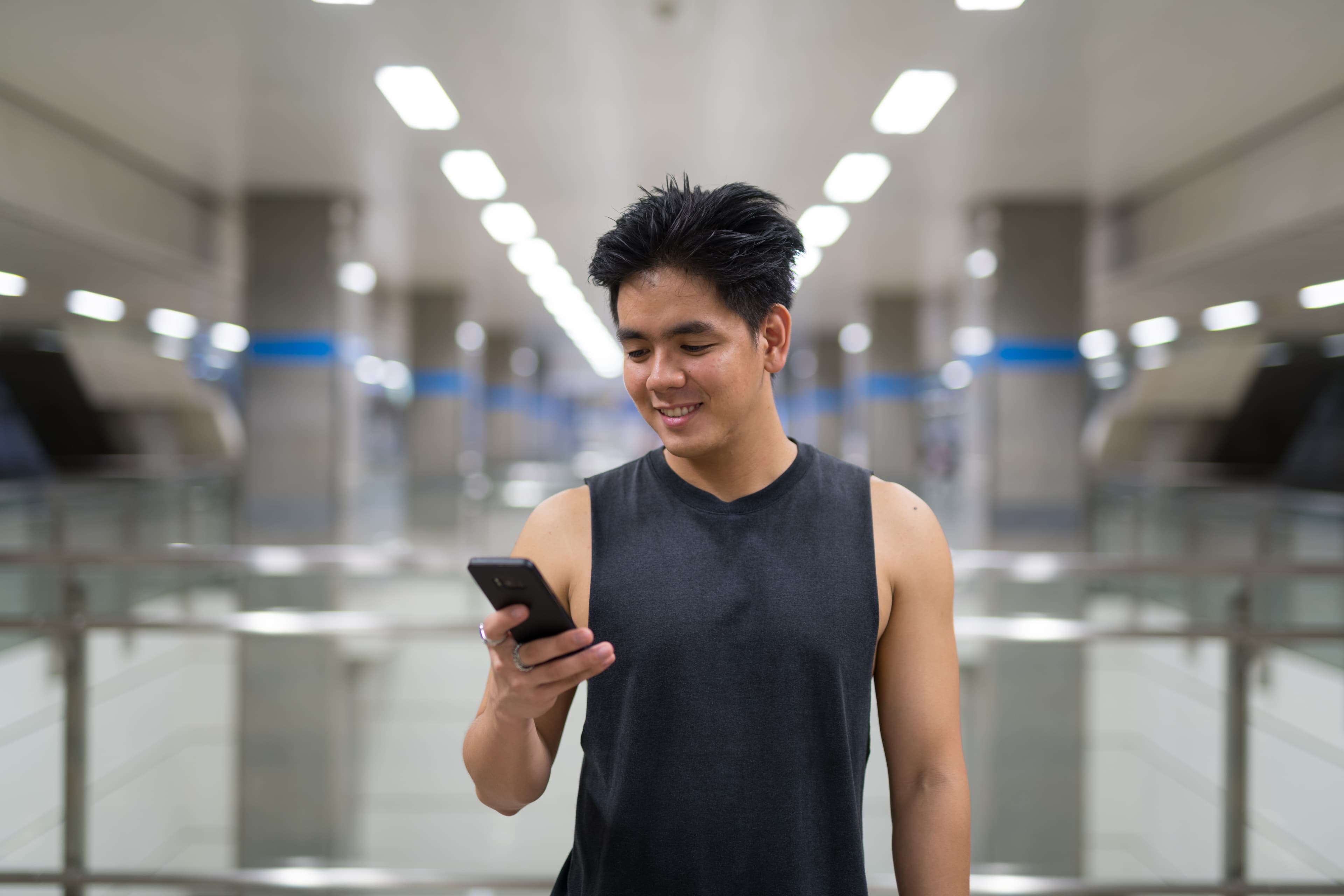 A guy looking at the PKLPlace app on his phone